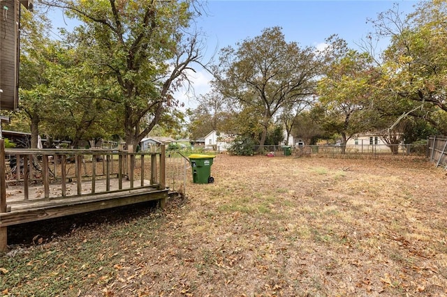 view of yard with a wooden deck