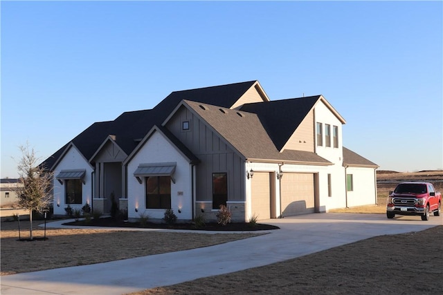 modern farmhouse featuring a garage