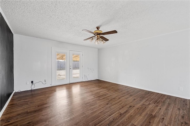 unfurnished room featuring dark hardwood / wood-style floors, a textured ceiling, and ceiling fan