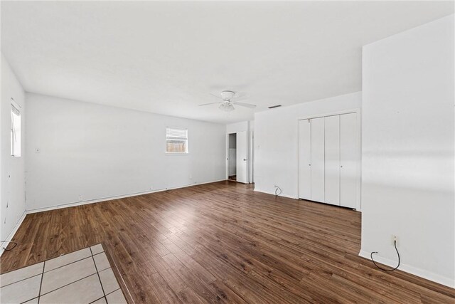 empty room featuring hardwood / wood-style flooring and ceiling fan