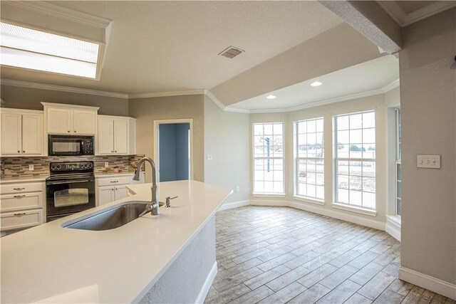 unfurnished dining area featuring hardwood / wood-style floors, lofted ceiling, and crown molding