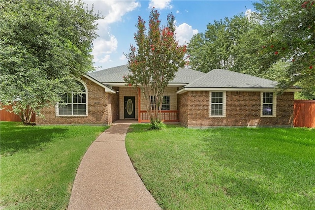 ranch-style house featuring a front lawn