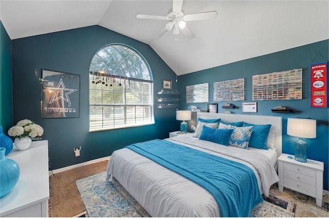 carpeted bedroom featuring ceiling fan and vaulted ceiling