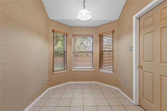 empty room with light tile patterned floors