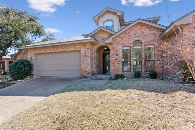 view of front facade with a garage, concrete driveway, and brick siding