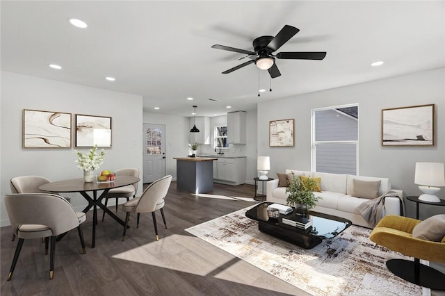 living area featuring dark wood-style floors, recessed lighting, and a ceiling fan