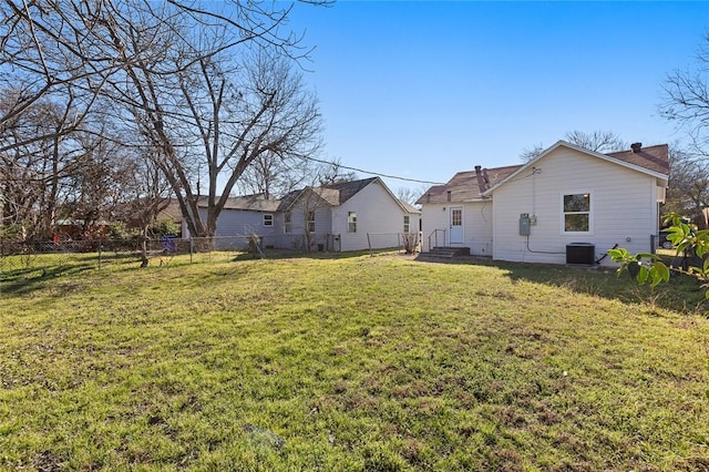 view of yard with a fenced backyard and central air condition unit