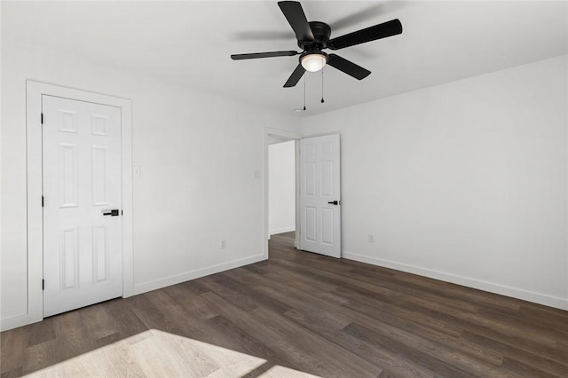 unfurnished bedroom featuring ceiling fan, baseboards, and dark wood-style flooring