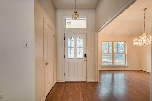 doorway with wood-type flooring and a notable chandelier