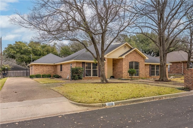 ranch-style house with a front lawn