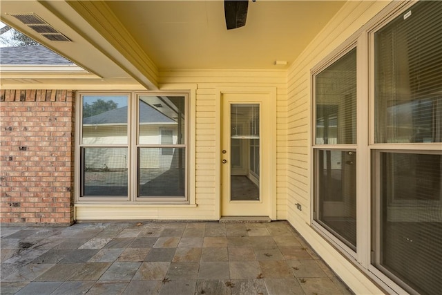 doorway to property featuring a patio