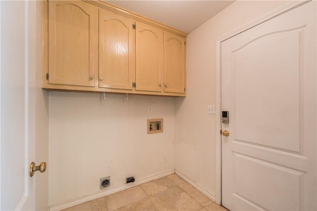 clothes washing area with washer hookup, cabinets, and hookup for an electric dryer