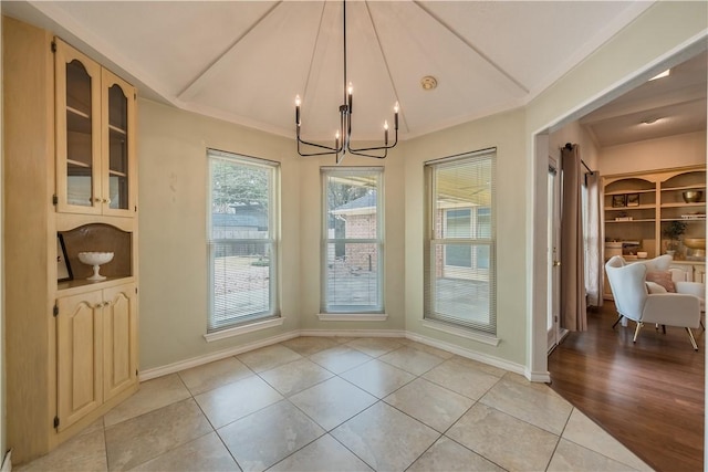 interior space featuring light tile patterned flooring and a notable chandelier