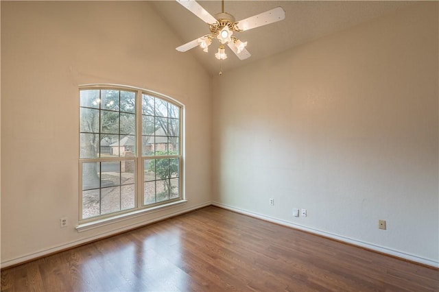 empty room featuring lofted ceiling, hardwood / wood-style floors, and ceiling fan