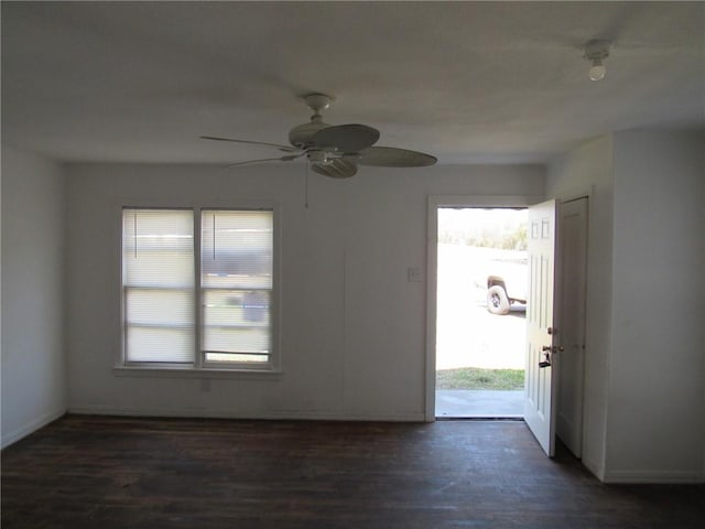 foyer entrance with a ceiling fan, dark wood-style floors, and a wealth of natural light