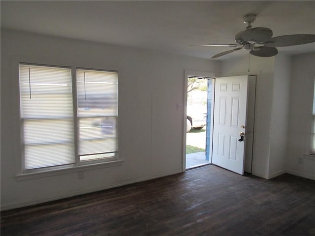 entrance foyer with dark wood finished floors and a ceiling fan