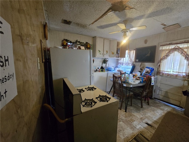 kitchen with white fridge and ceiling fan