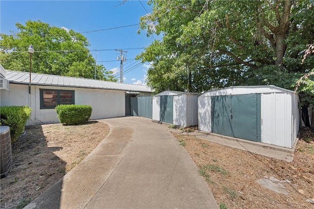 view of front of home featuring a storage shed