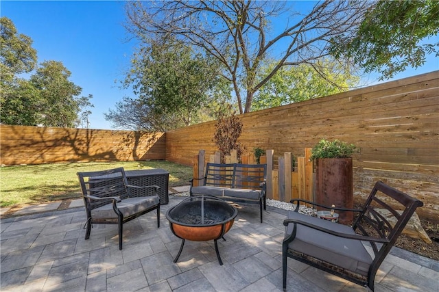 view of patio / terrace with a fire pit