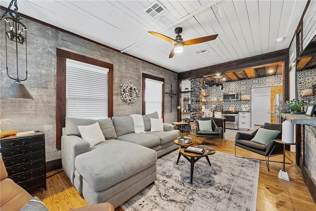 living room featuring ceiling fan, beam ceiling, wood ceiling, and light hardwood / wood-style flooring