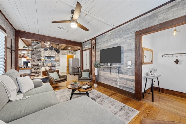 living room featuring ceiling fan, wooden ceiling, brick wall, and hardwood / wood-style flooring