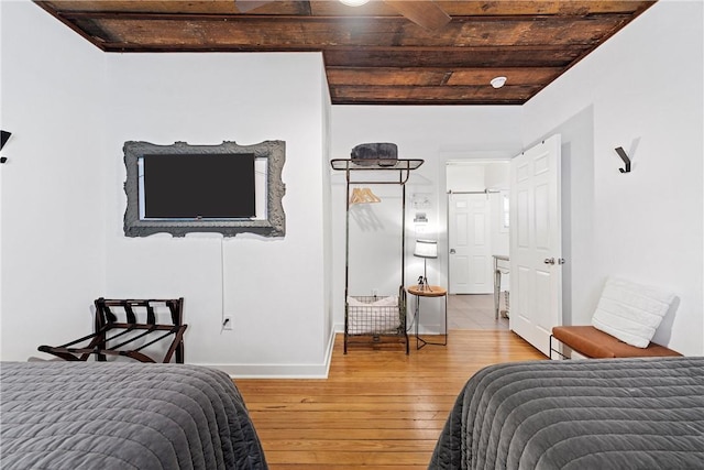 bedroom featuring wooden ceiling and hardwood / wood-style flooring