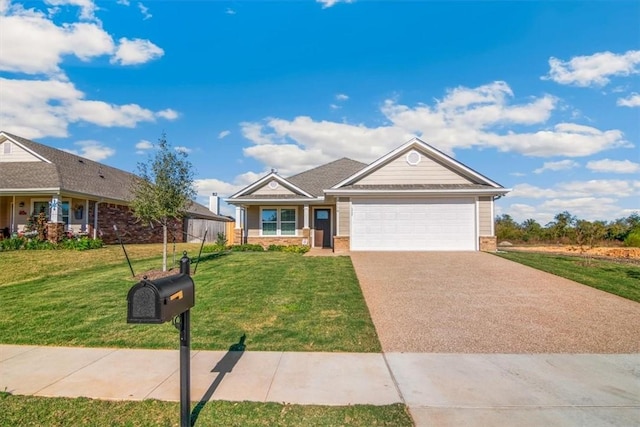 view of front of property with a front yard and a garage