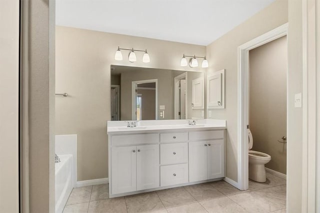 bathroom with tile patterned floors, vanity, toilet, and a washtub