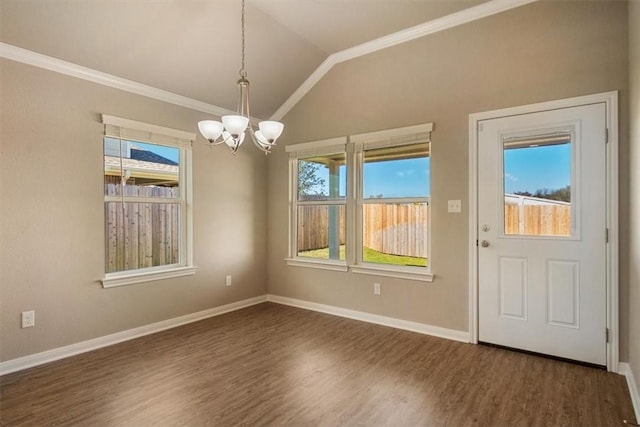 unfurnished dining area with dark hardwood / wood-style floors, vaulted ceiling, and a wealth of natural light