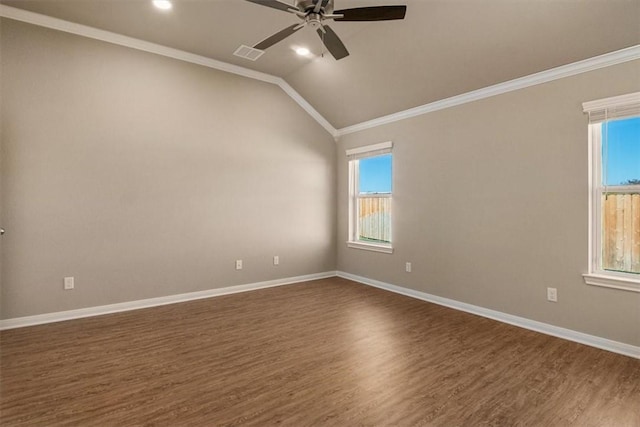 unfurnished room with ceiling fan, ornamental molding, dark wood-type flooring, and vaulted ceiling