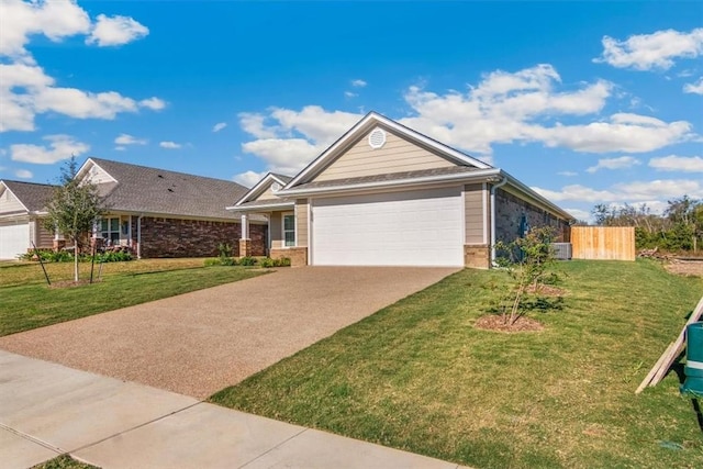 view of front of property featuring a garage and a front lawn