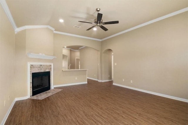 unfurnished living room with dark hardwood / wood-style floors, ceiling fan, and ornamental molding