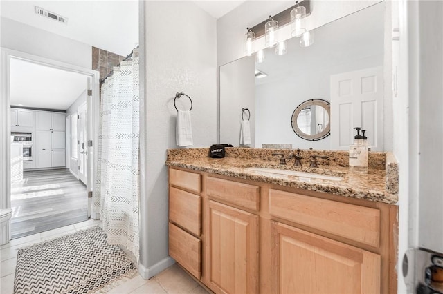 bathroom featuring vanity and tile patterned floors