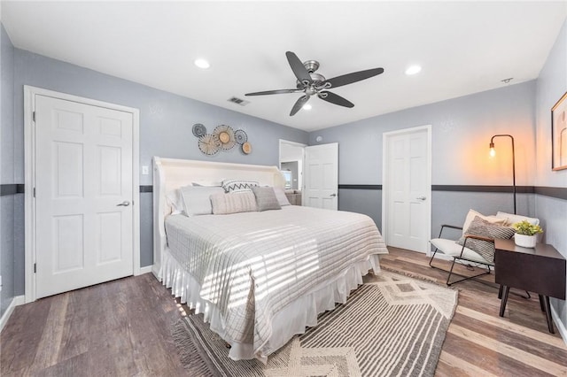 bedroom with hardwood / wood-style floors and ceiling fan