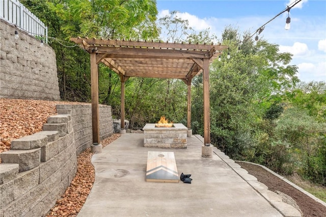 view of patio featuring a pergola and an outdoor fire pit