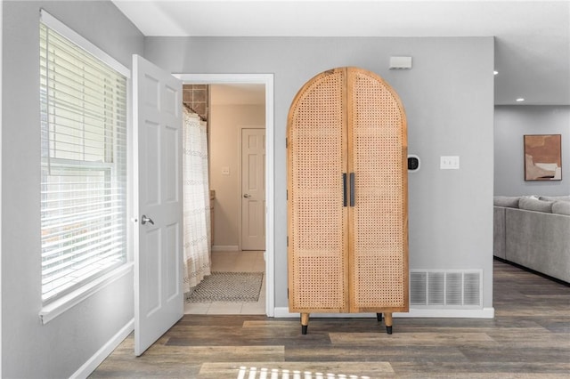 hallway featuring hardwood / wood-style floors