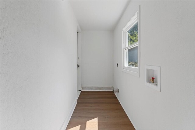 washroom with hardwood / wood-style floors and hookup for a washing machine