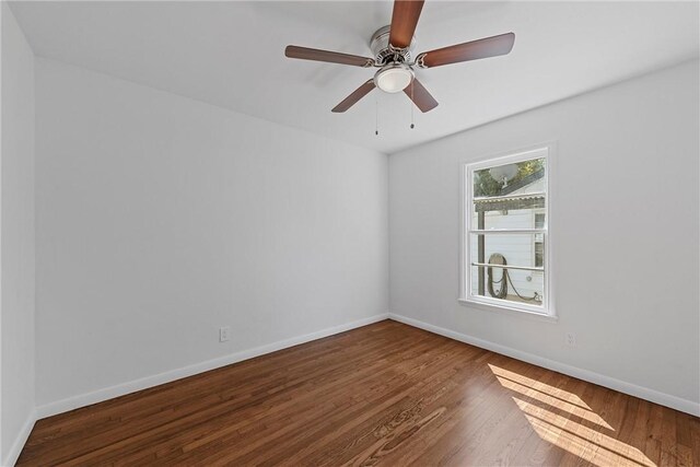 unfurnished room featuring hardwood / wood-style flooring and ceiling fan