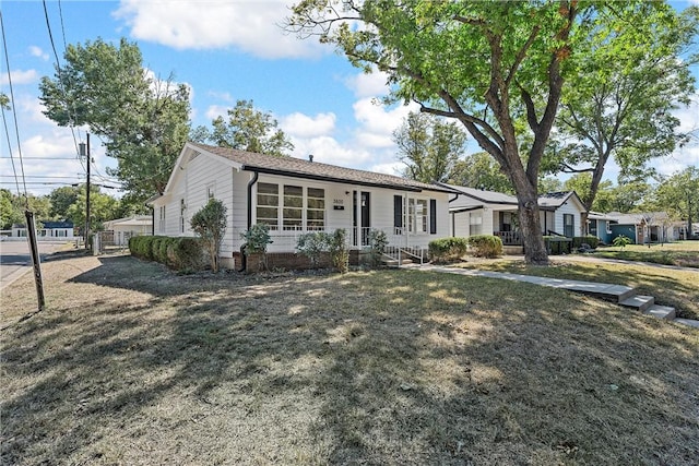 ranch-style house with a front lawn and a porch