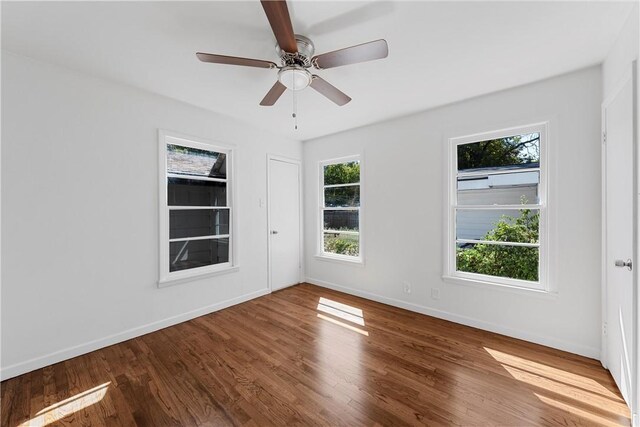 spare room featuring ceiling fan and wood-type flooring