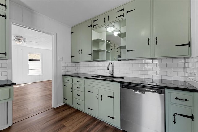 kitchen featuring dishwasher, sink, tasteful backsplash, dark hardwood / wood-style floors, and green cabinetry