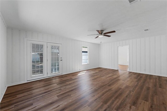 spare room with ceiling fan and dark wood-type flooring