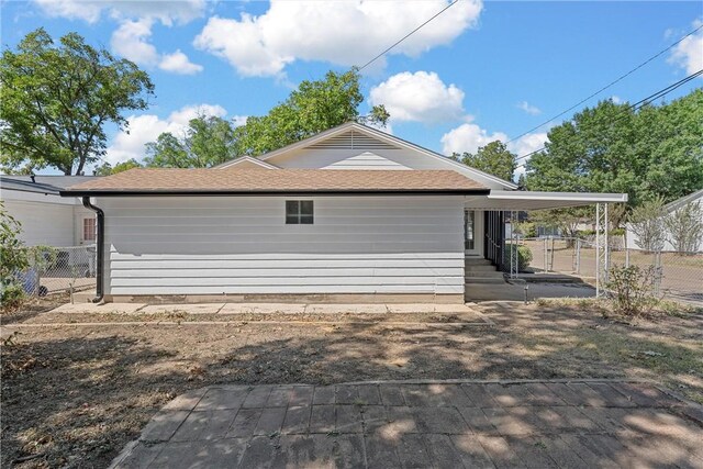 exterior space featuring a carport