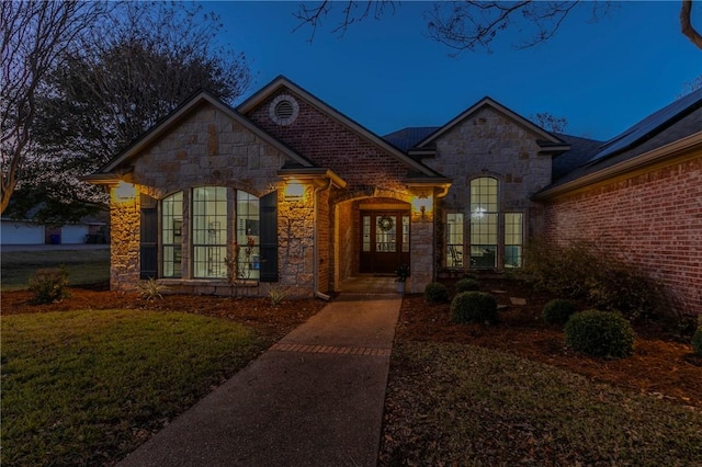 view of front of home with a lawn