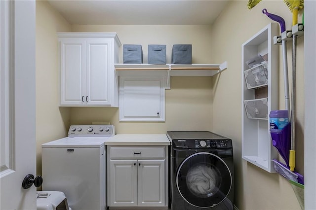 laundry area with cabinets