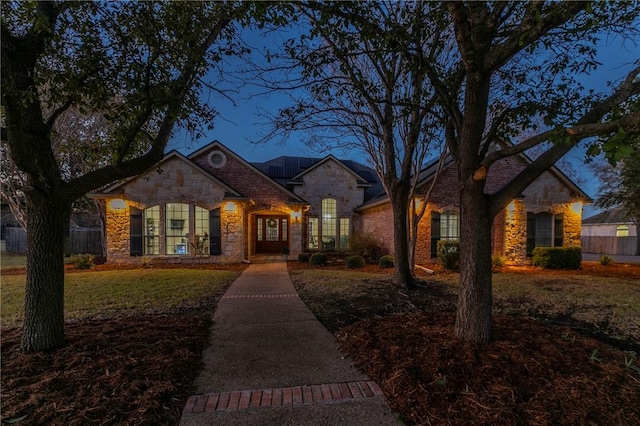 ranch-style home with a front yard