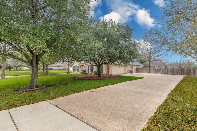 view of front of home featuring a garage and a front lawn