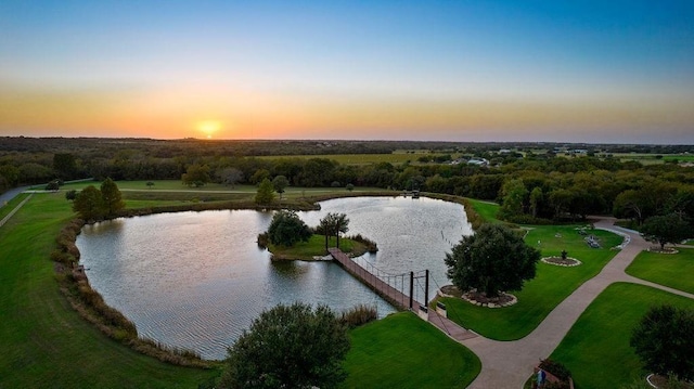 aerial view at dusk with a water view