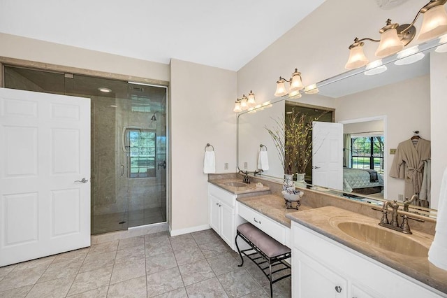 bathroom with vanity, an enclosed shower, and tile patterned flooring