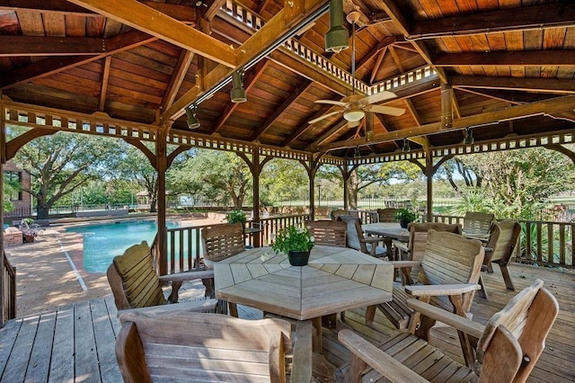 wooden deck featuring a gazebo and ceiling fan